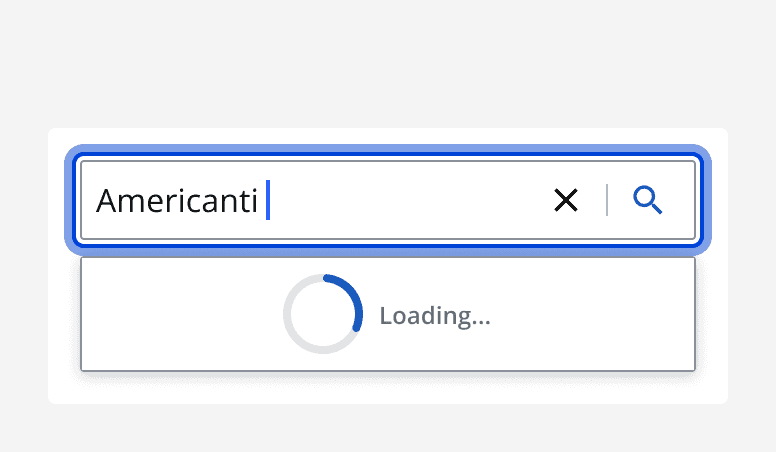 A search bar with an entered search term that displays a loading indicator whilst the search is occurring.